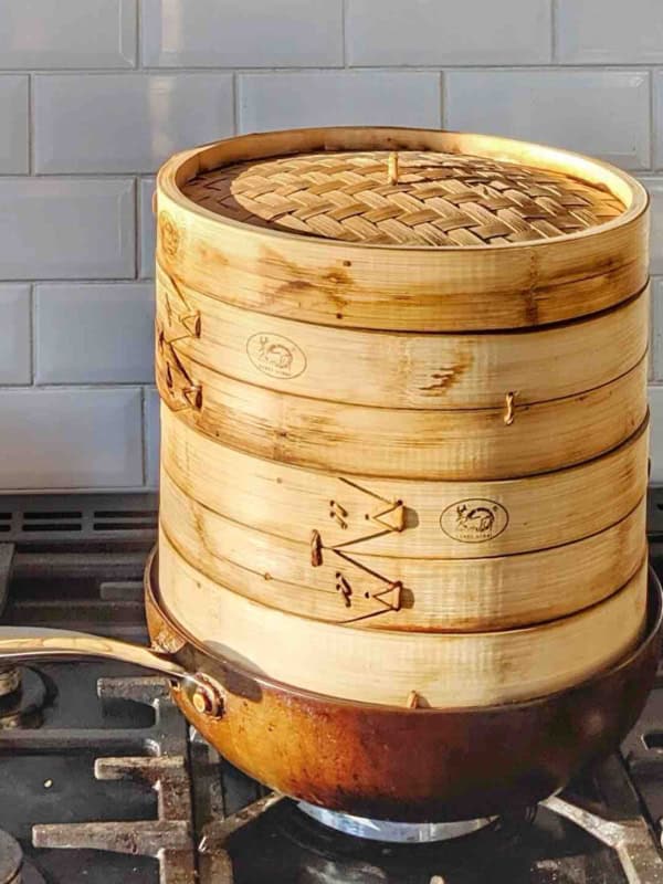 bamboo steamer inside a wok.