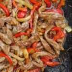 stir-frying beef with vegetables.