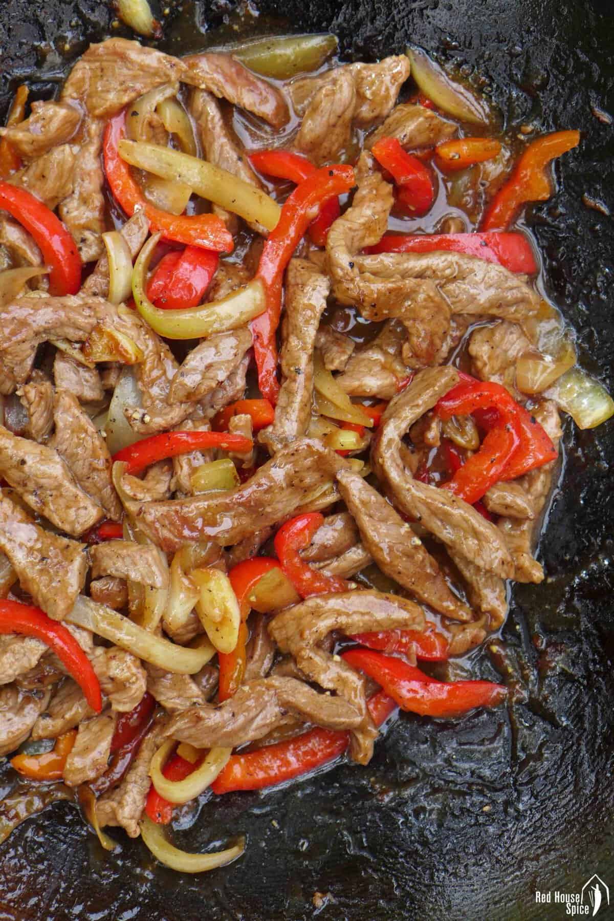 stir-frying beef with vegetables.