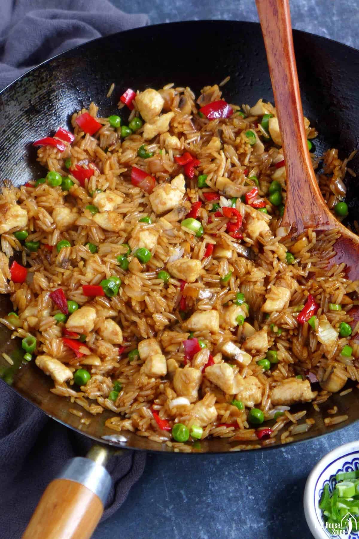 chicken fried rice in a wok.