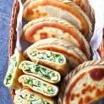pan-fried, flat dumplings filled with chives, eggs and vermicelli with overlay text that says Chinese chive pockets.