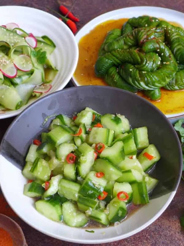 Three plates of Chinese cucumber salad
