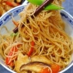chow mei fun picked up by chopsticks.