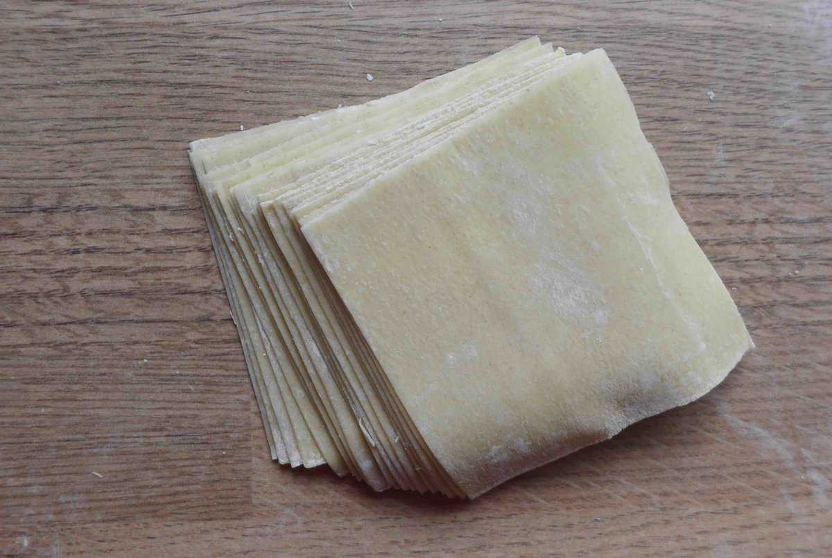 a pile of homemade wonton wrappers.