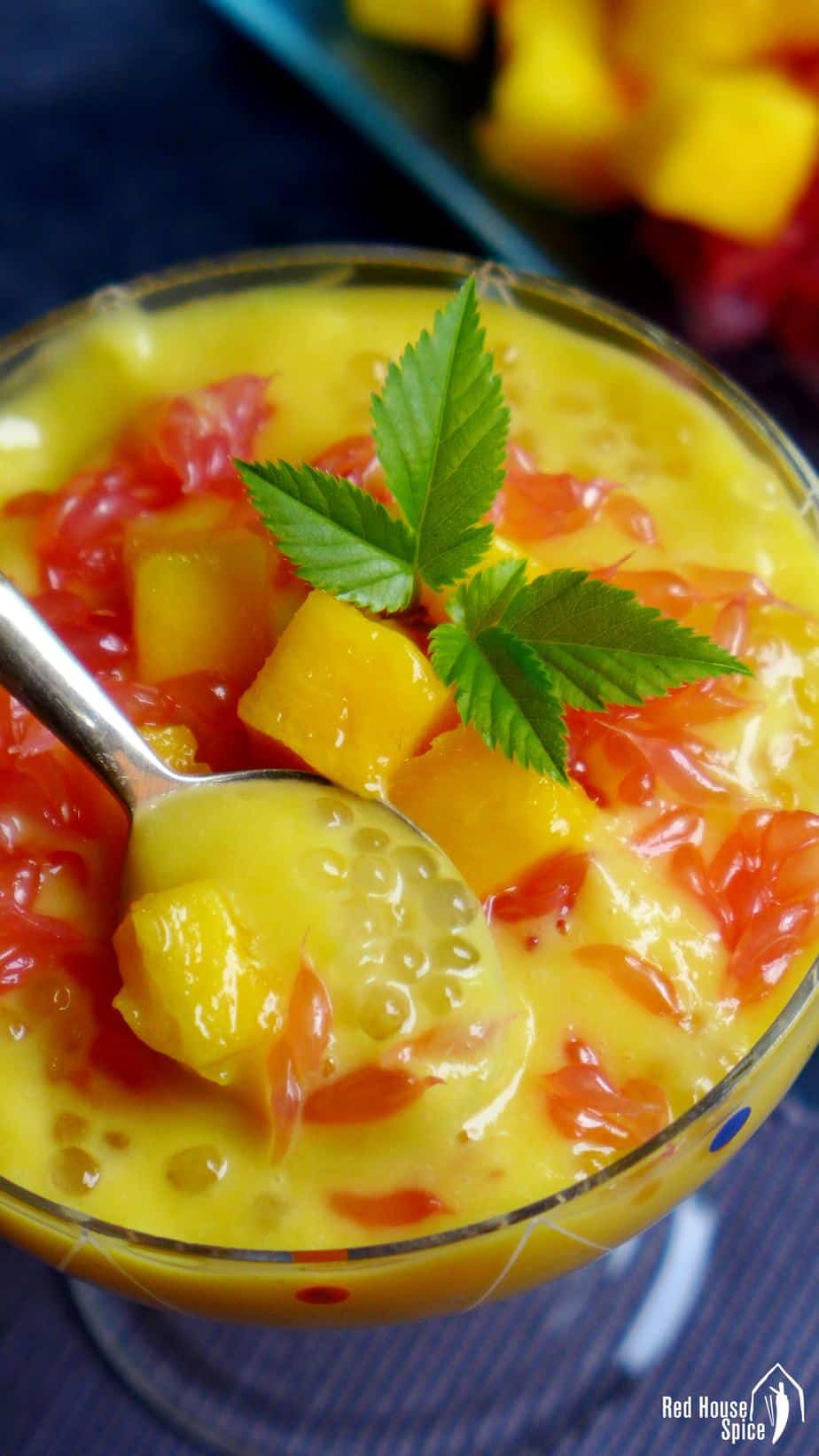 A spoon in a bowl of mango sago