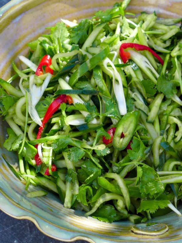 Northeast tiger salad made with cucumber, chilies, scallions and cilantro.