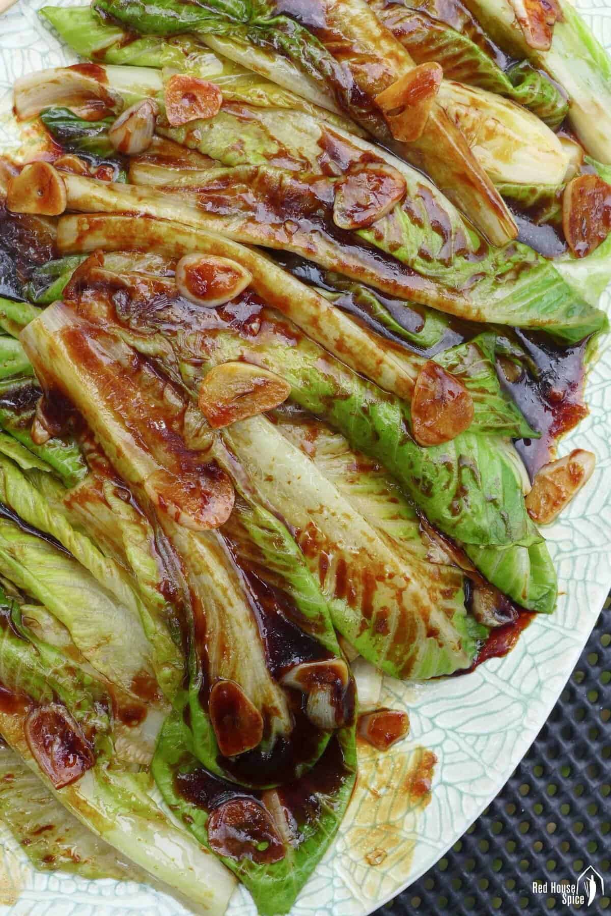 blanched lettuce with oyster sauce based seasoning and garlic.