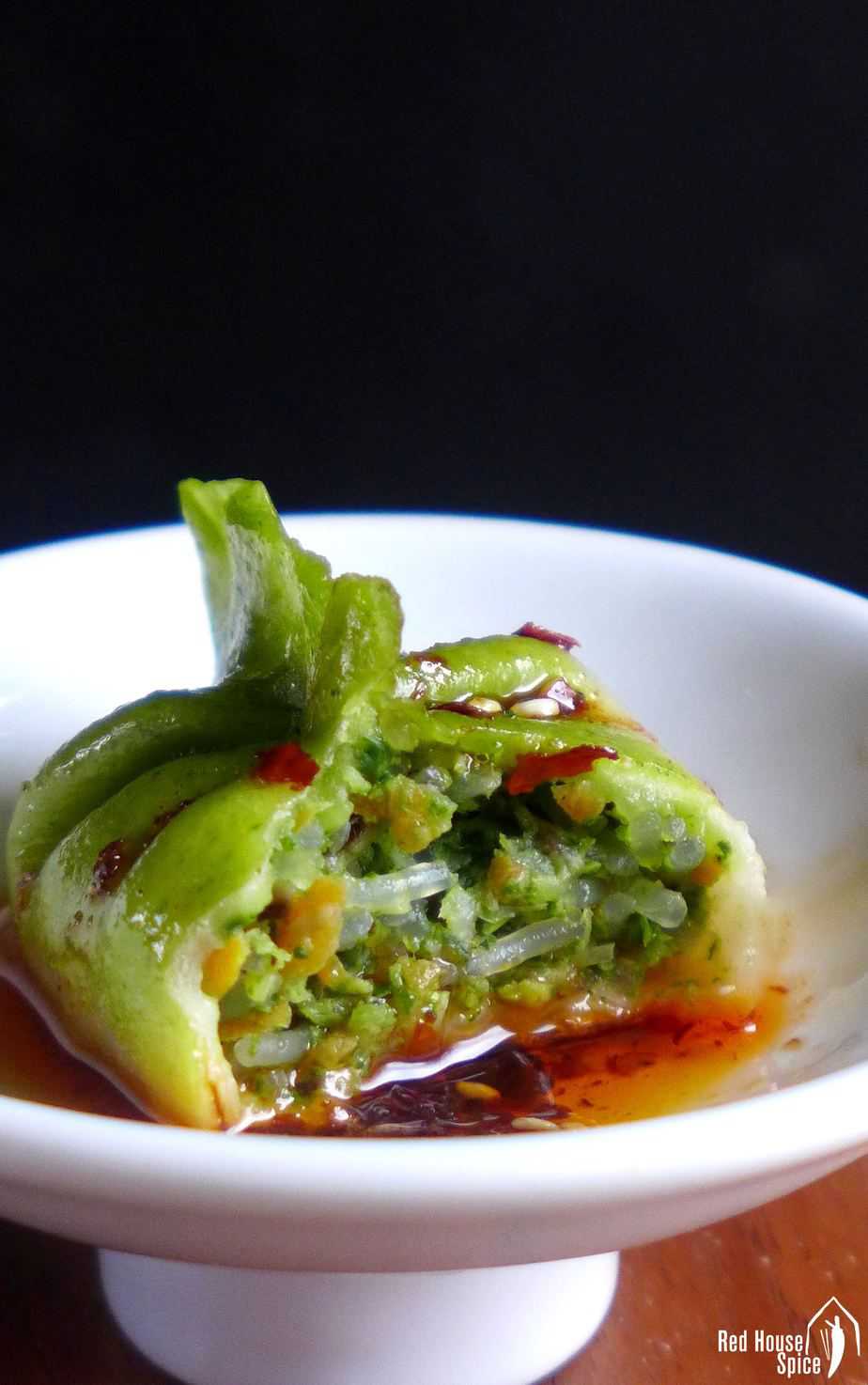 A half eaten vegetarian dumpling