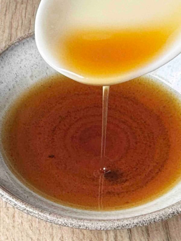 pouring sesame oil.