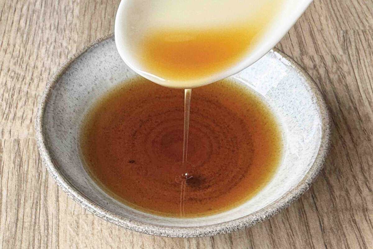 pouring sesame oil.