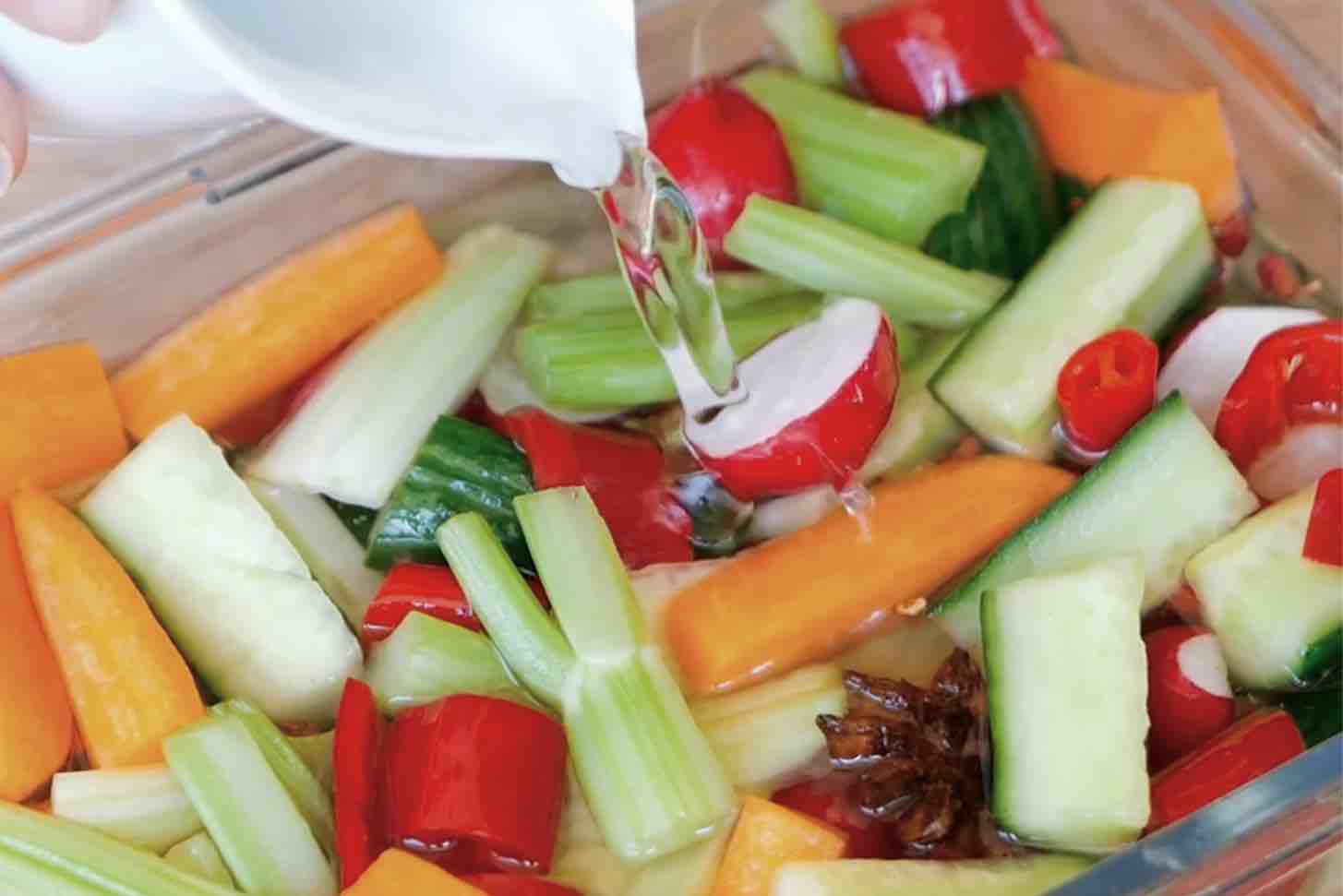pouring water to vegetables.