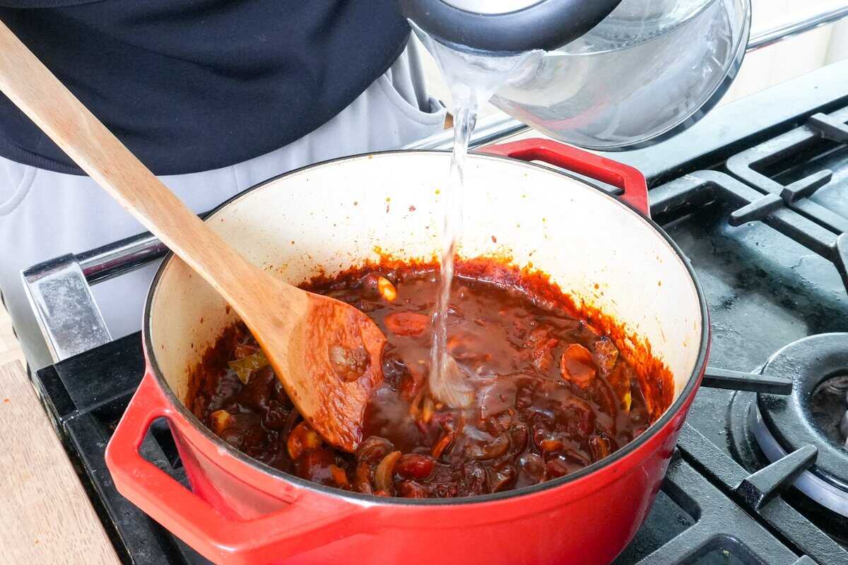 adding water to pot.