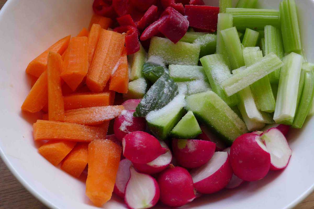 salt over cut vegetables.