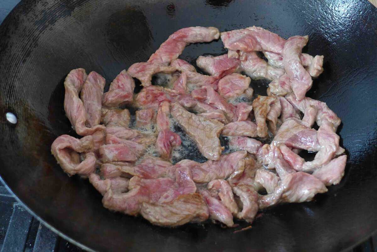 searing beef strips.