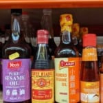 bottles of toasted sesame oil with overlay text that says sesame oil guide.