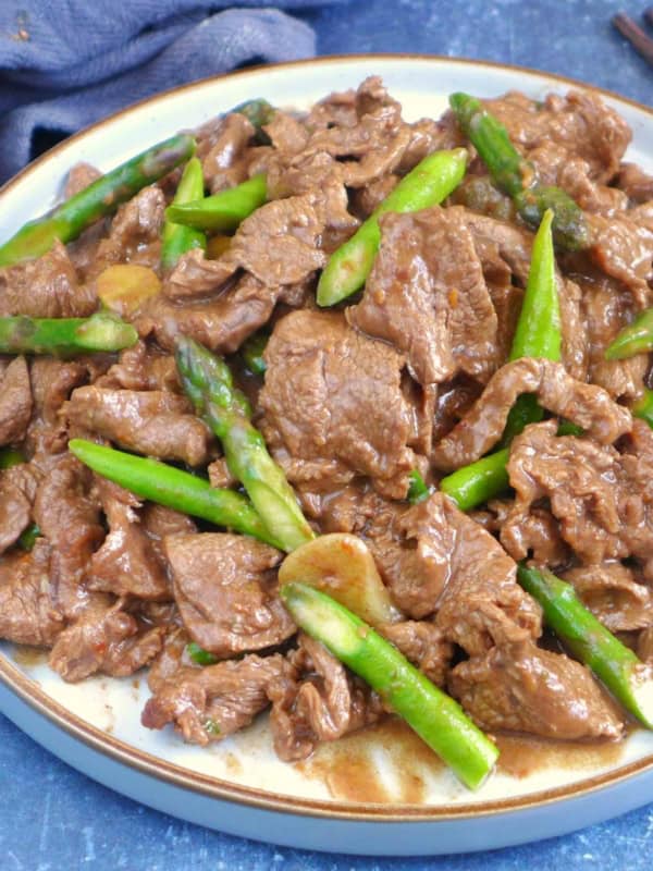 a plate of Sha Cha Beef with asparagus.