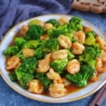 stir-fried shrimp and broccoli on a plate.