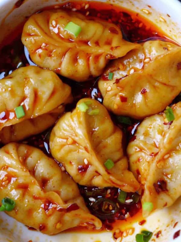 Boiled dumplings in spicy sauce
