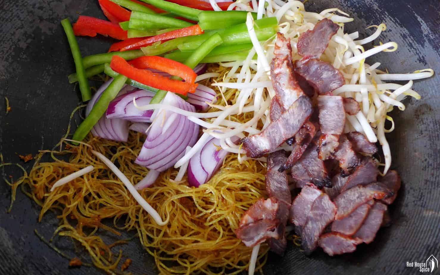 Char Siu, vegetables and noodles in a wok