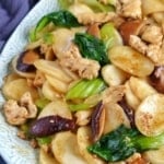 stir-fried rice cakes with chicken and vegetables.
