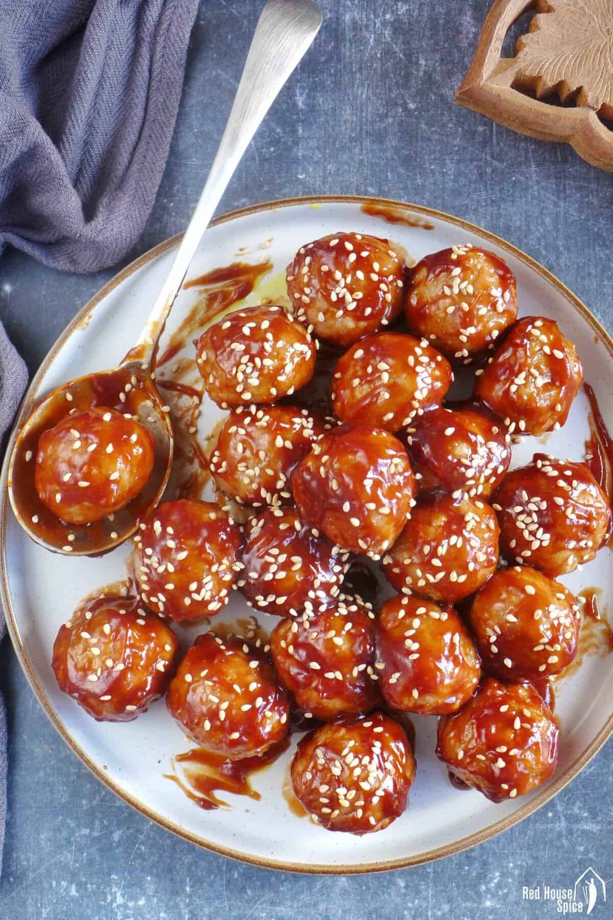Chinese sweet and sour meatballs on a plate.