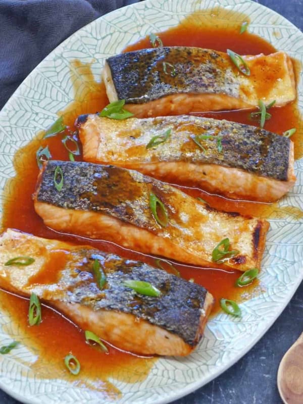 A plate of sweet and sour salmon.