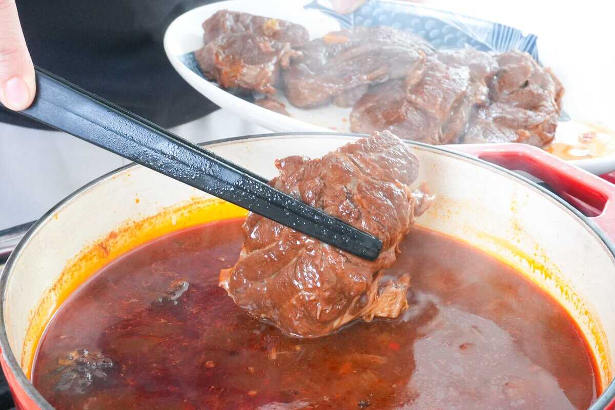 taking beef out of broth.