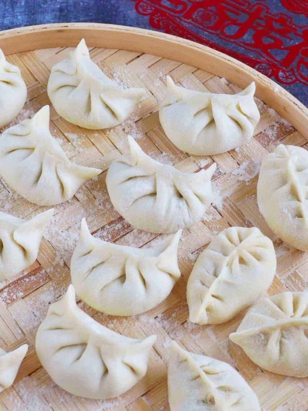 uncooked dumplings on a tray