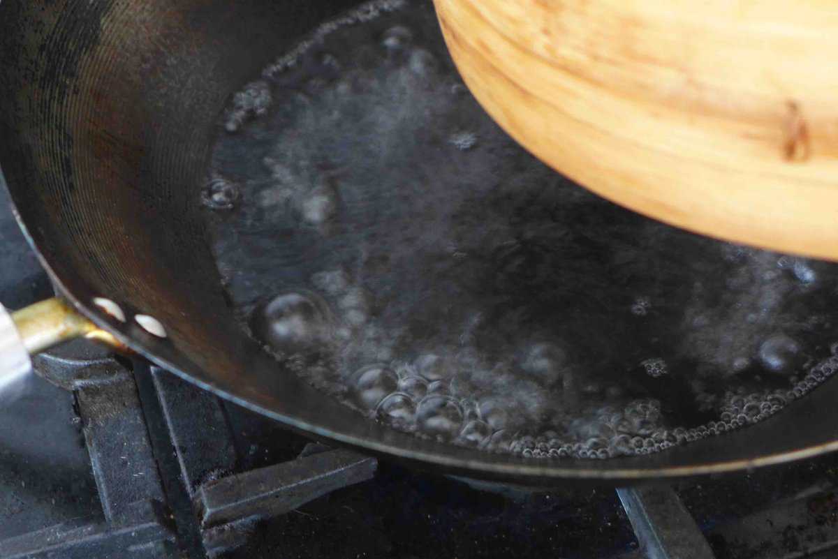 water boiling in a wok.